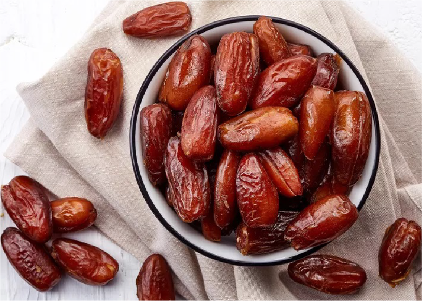 Fresh dates on palm tree